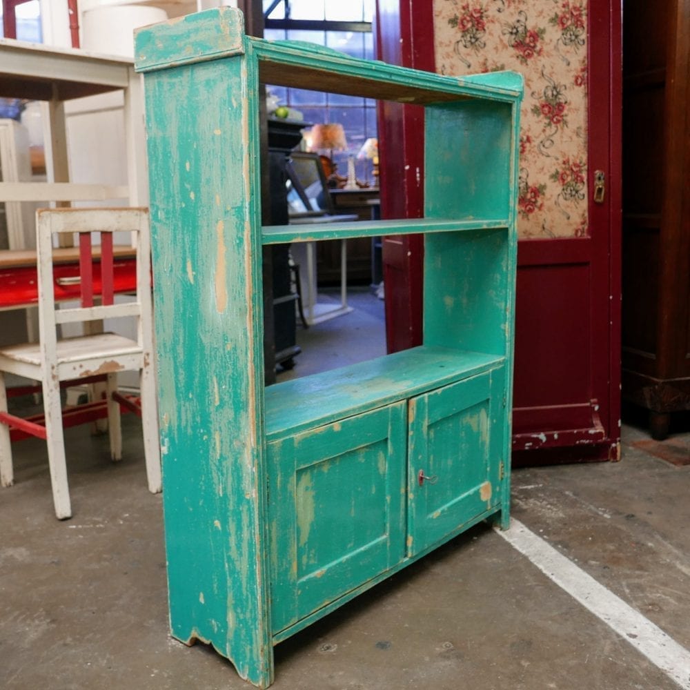 Mintgroene boekenkast