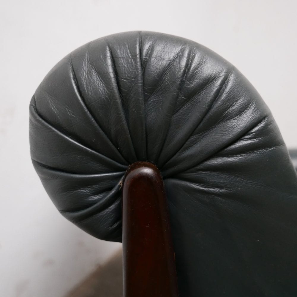 Donkergroen leren fauteuil