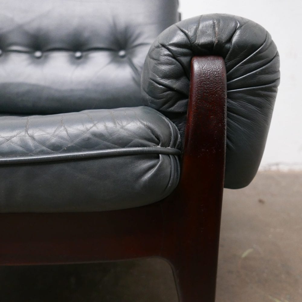 Donkergroen leren fauteuil