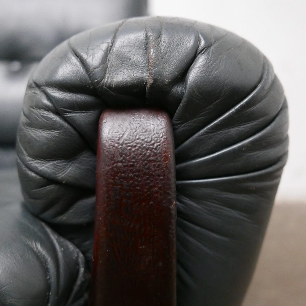 Donkergroen leren fauteuil